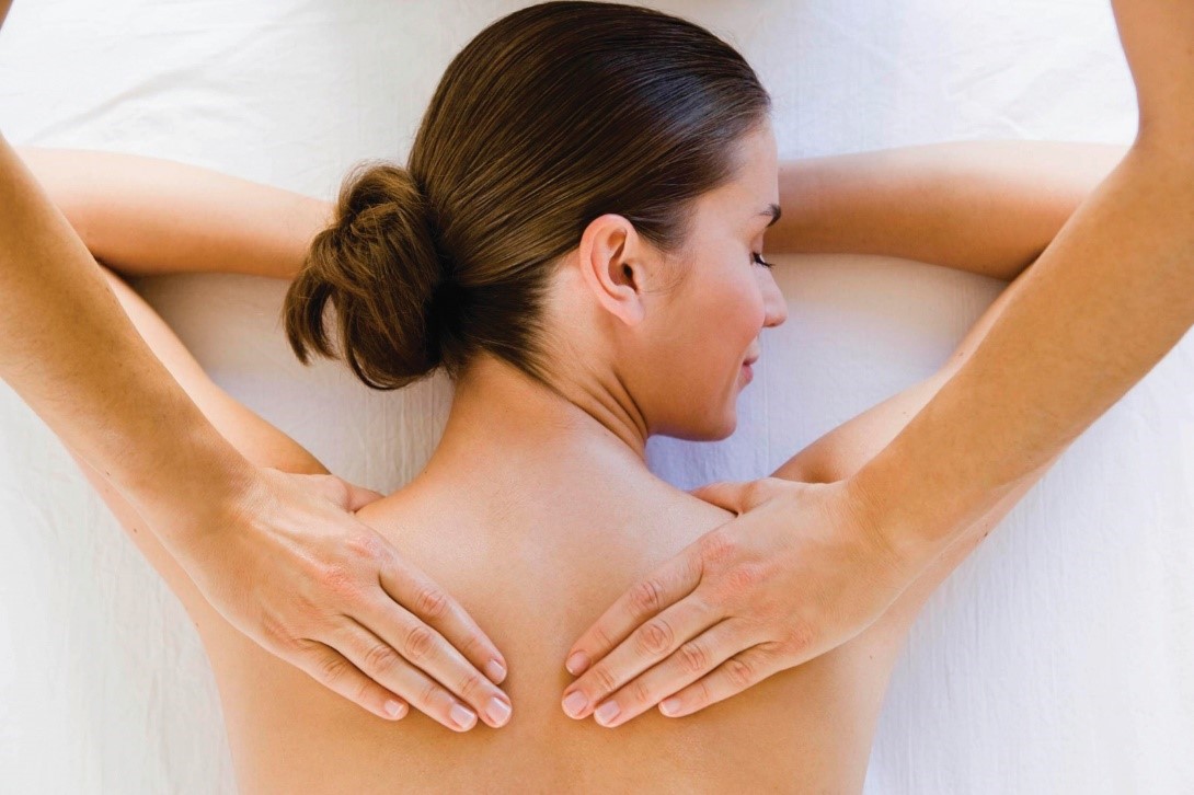Combat-Holiday-Stress woman relieving stress with a massage