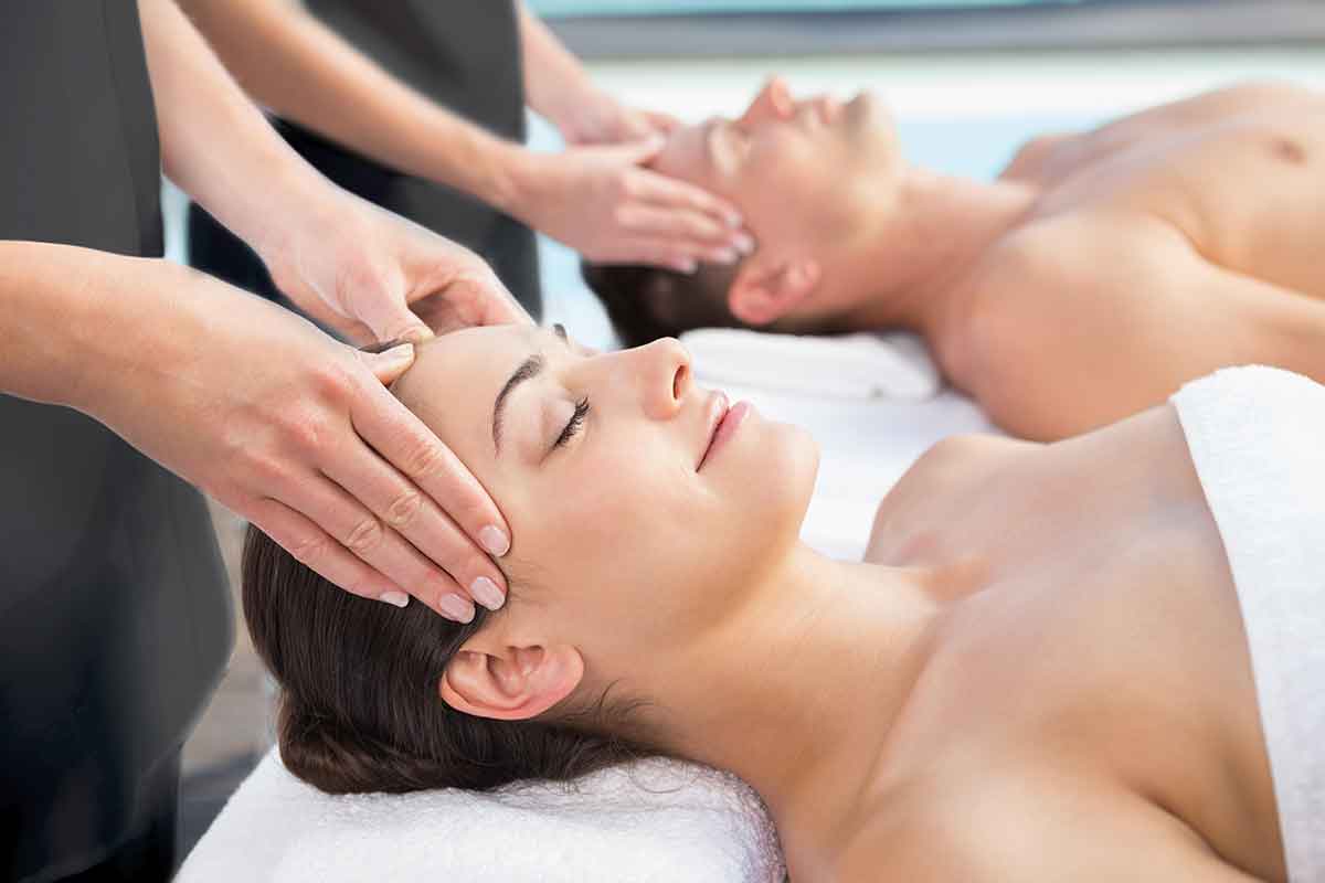 a man and woman receiving a couples massage at spavia day spa