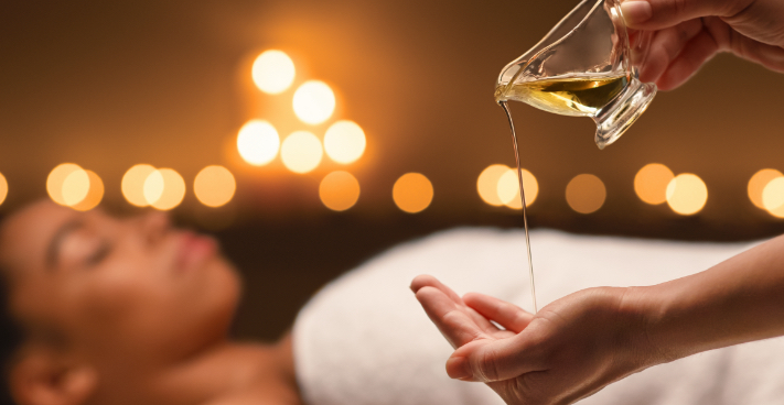 massage therapist with massage oil