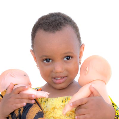 child with toys donated by spavia